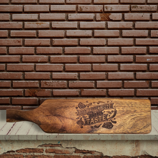 Small Paddle Engraved Serving Board with Phrase "It's All About that Taste"